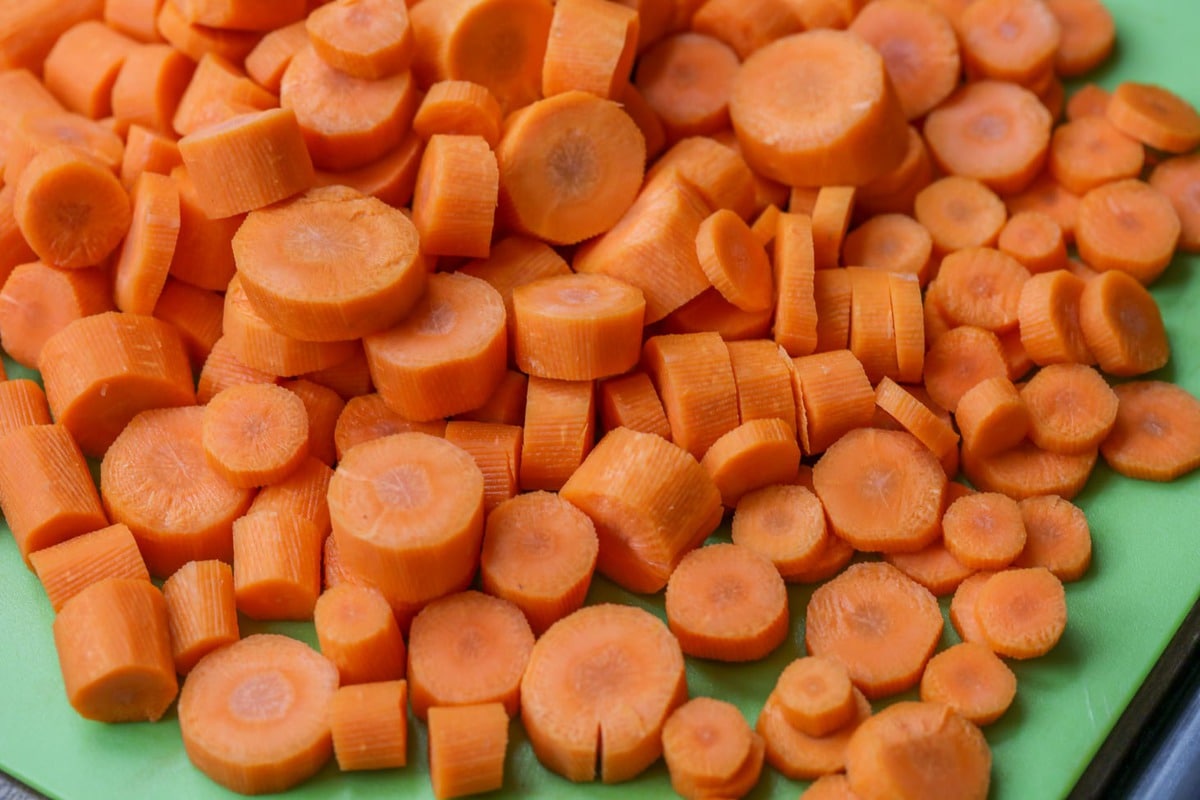 cut carrots on a green cutting board