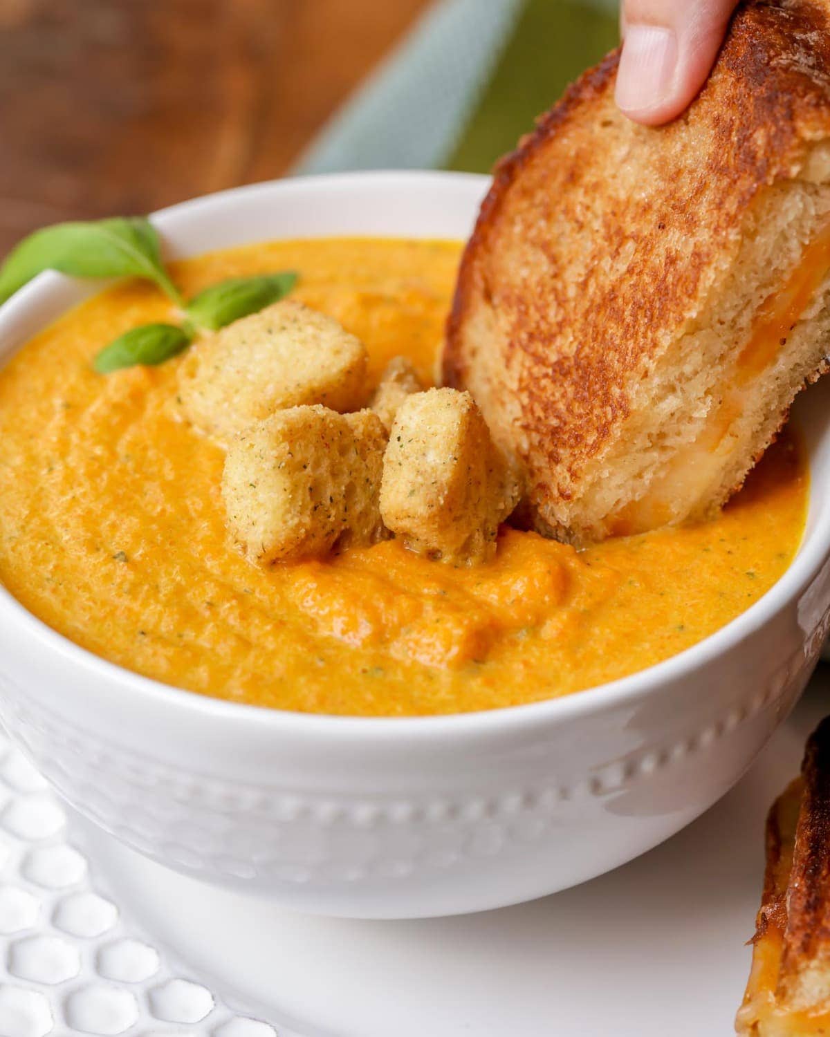 Roasted Carrot Soup served in a white bowl
