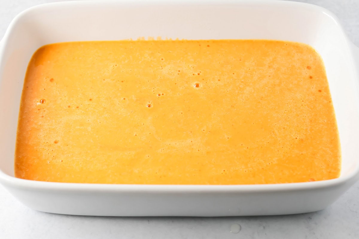 Pumpkin batter poured into baking dish.