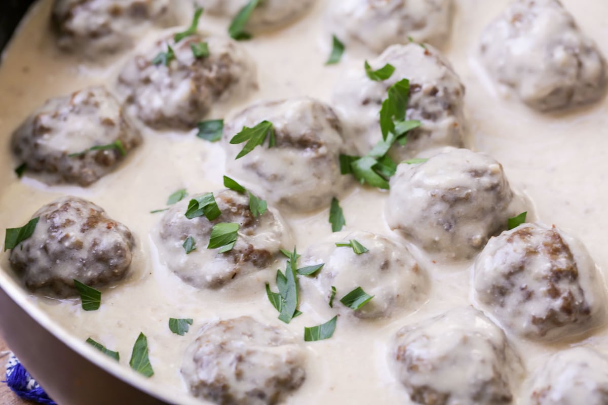 meatballs in a pan with swedish meatball sauce