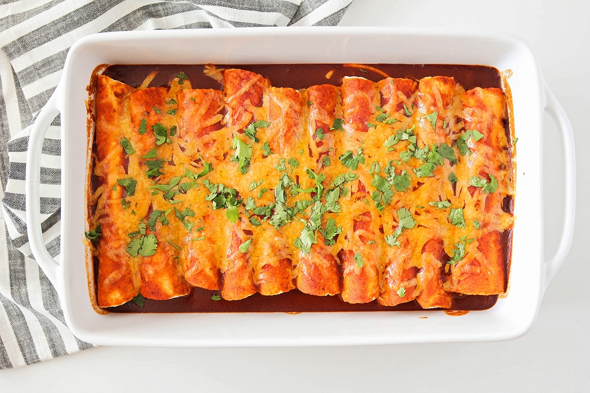 A pan full of shredded Beef Enchiladas