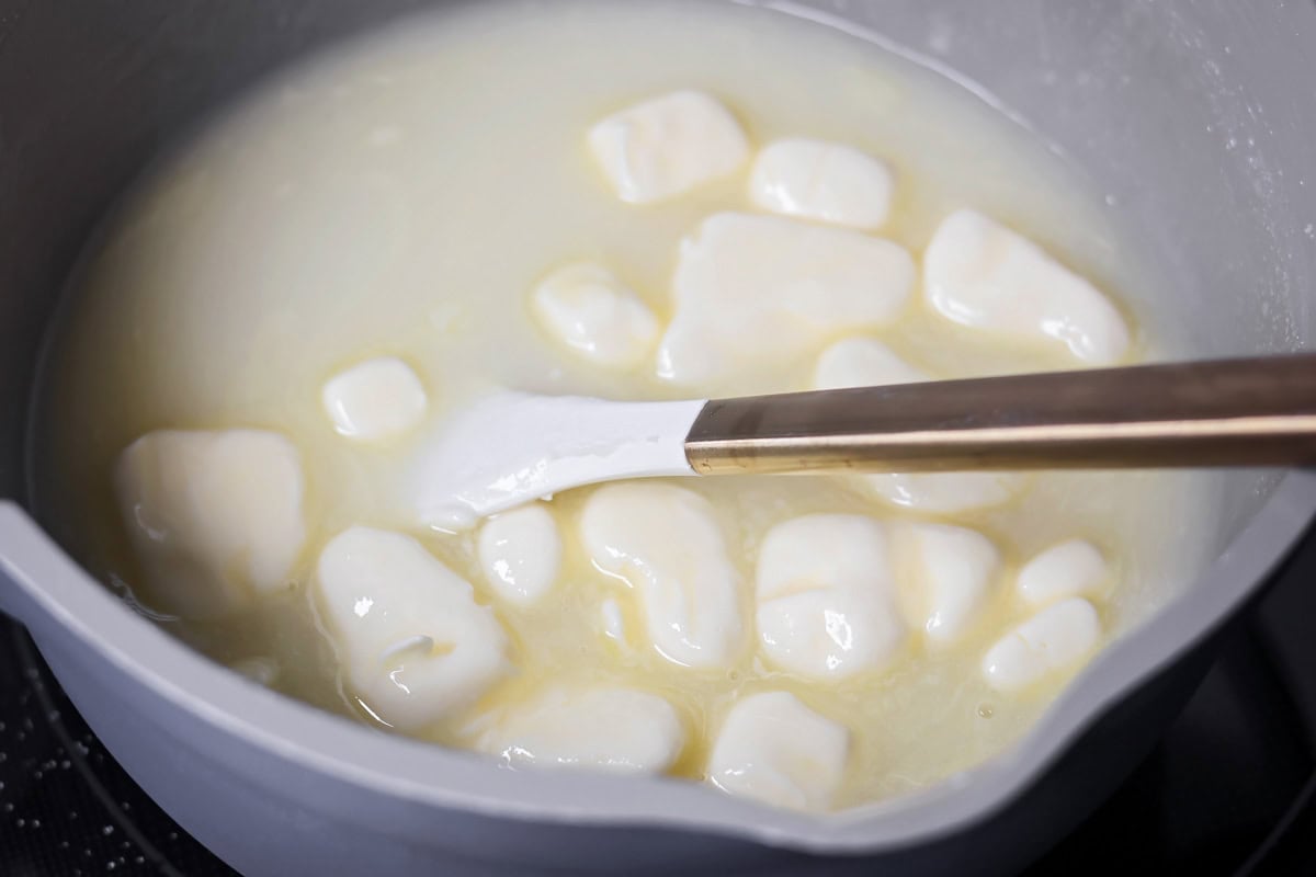 Sugar, butter and milk in pot.