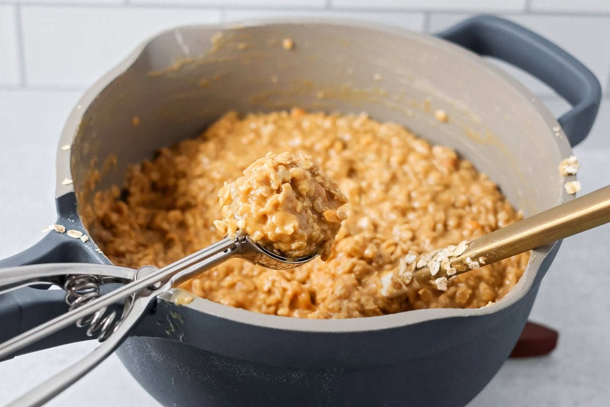 Peanut butter no bake cookies being scooped out.