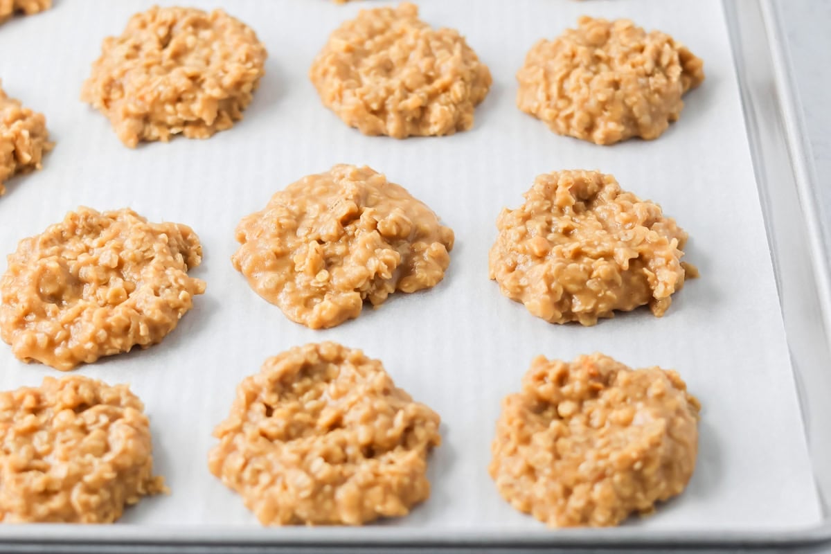 Peanut butter no bake cookies on parchment paper.