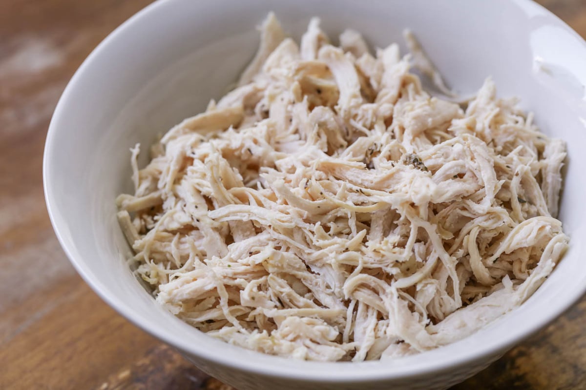 Shredded Chicken in a white bowl.