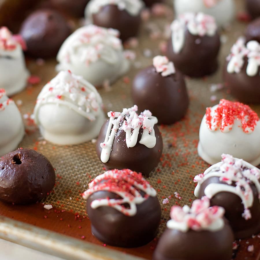 Peppermint Chocolate Truffles lined up on a cookie sheet