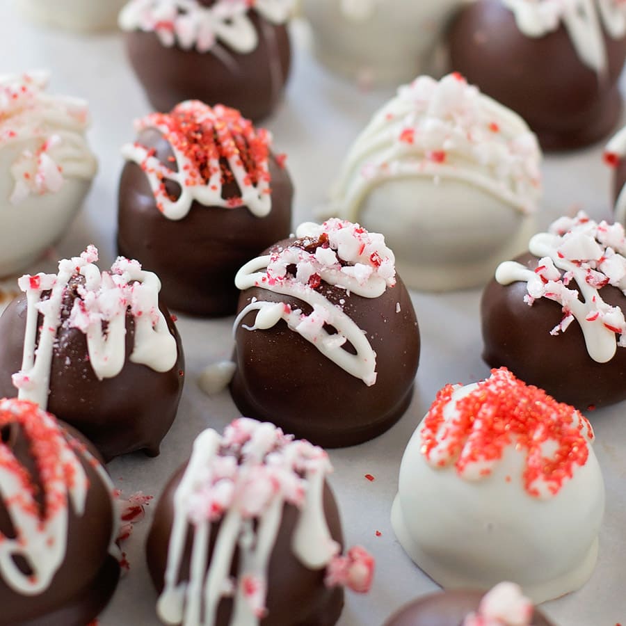 Christmas desserts - several peppermint chocolate truffles topped with sprinkles.