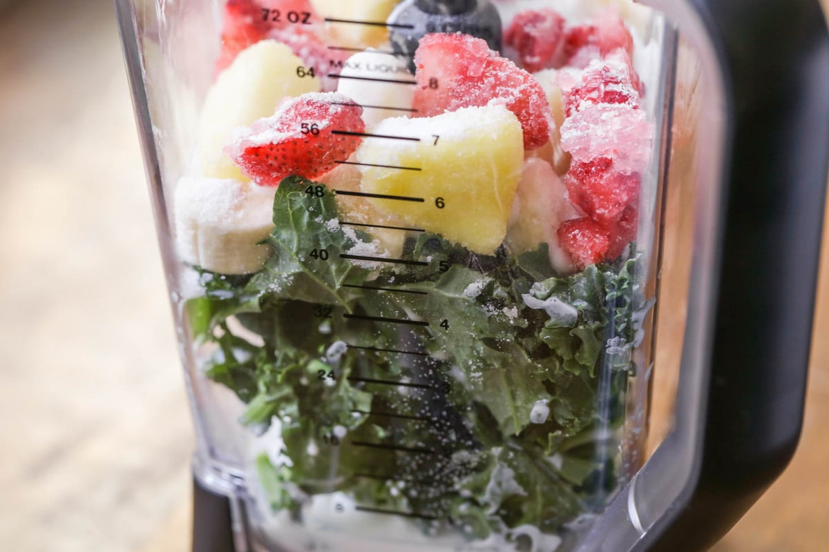 Frozen fruit and veggies in a blender.