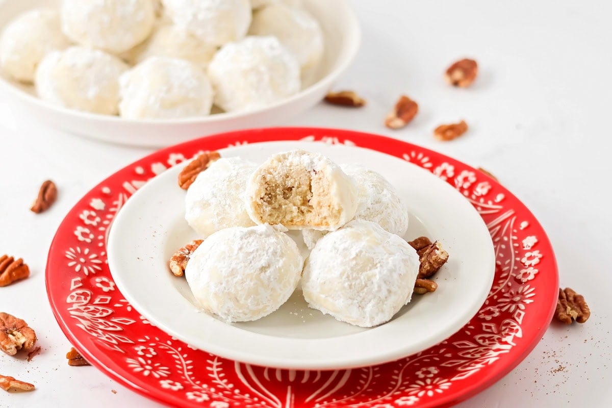 Snowball Cookies on white and red plate.