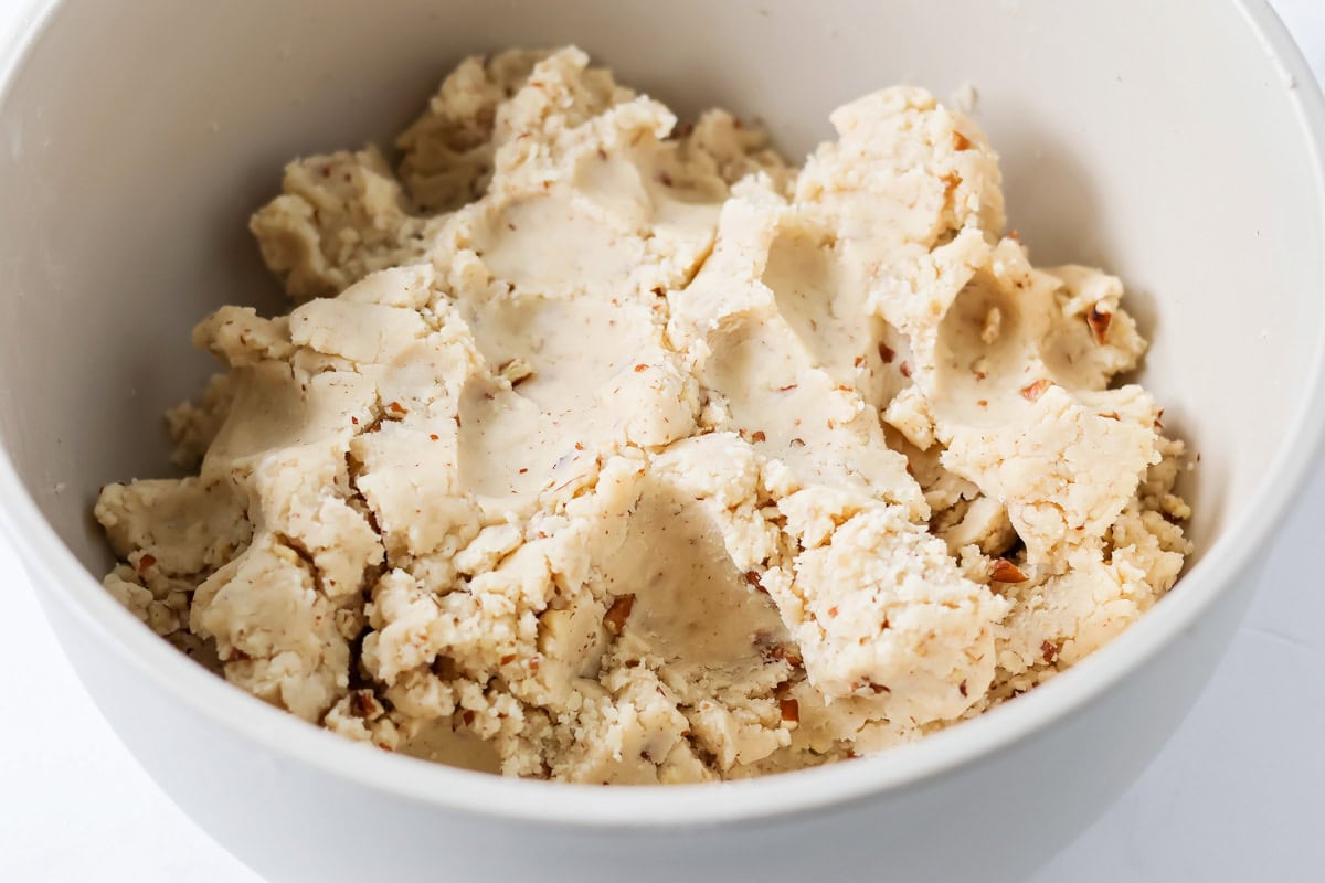 Snowball cookie dough in mixing bowl.