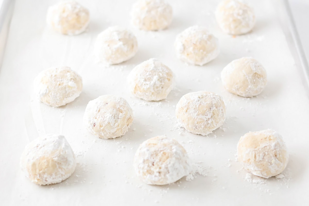 Snowball cookies covered in powdered sugar.