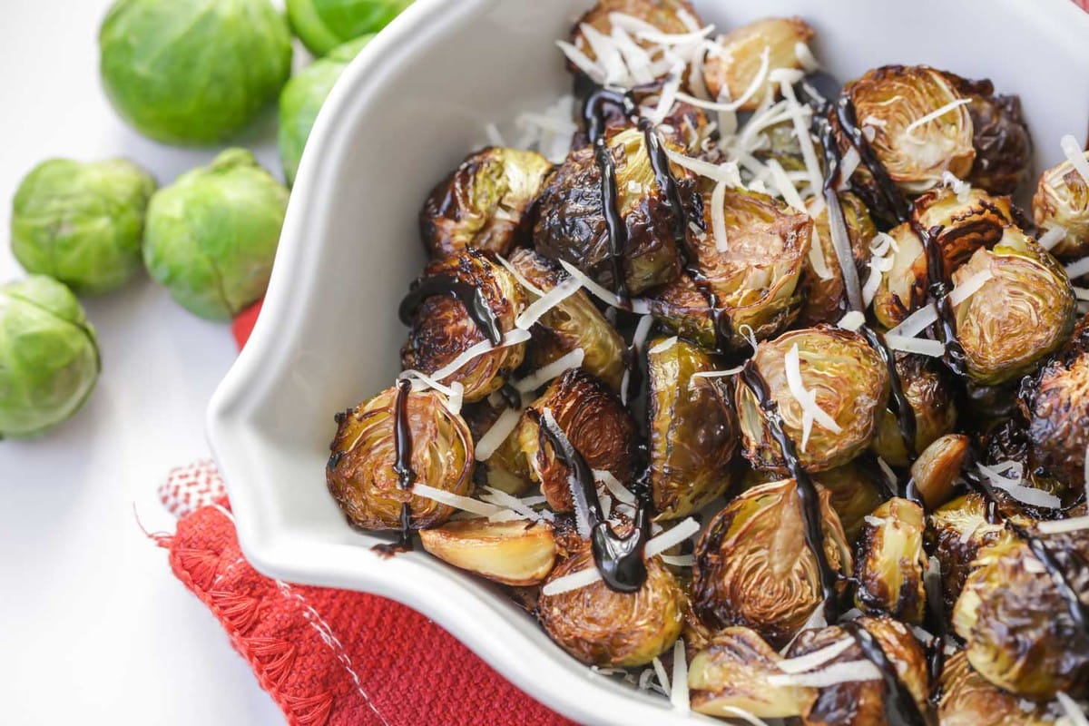 Balsamic glazed brussel sprouts topped with cheese.