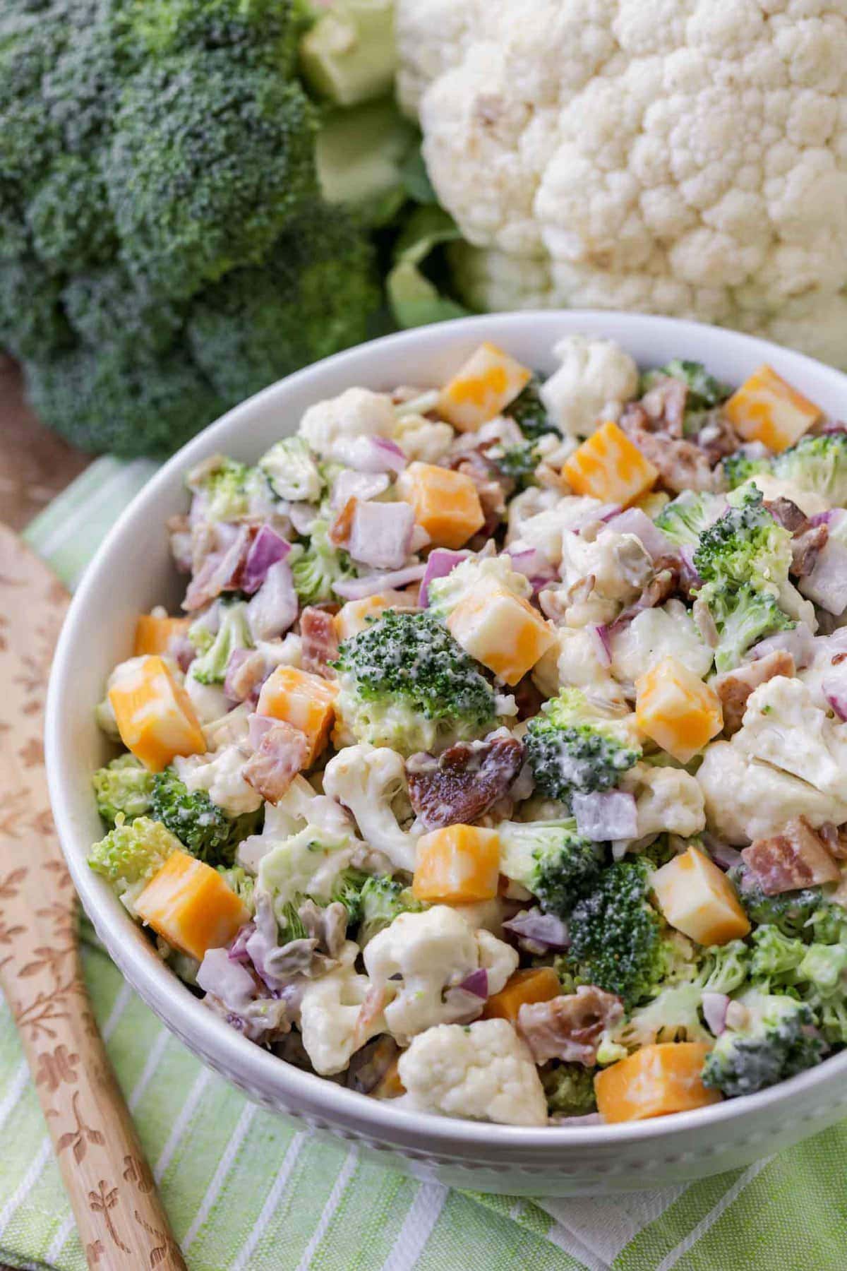 Broccoli Cauliflower Salad served in a white bowl.