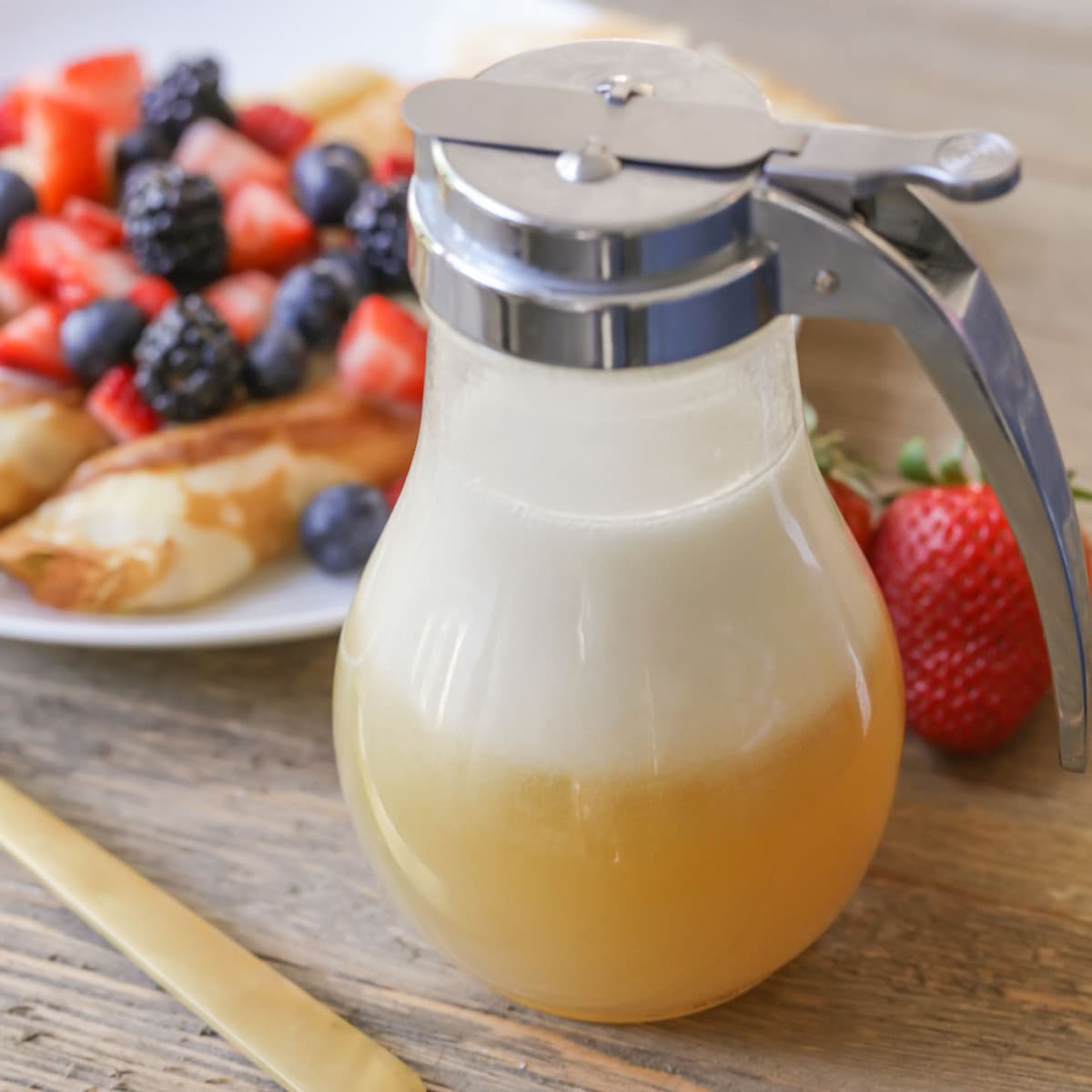 Buttermilk syrup inside a syrup dispenser.