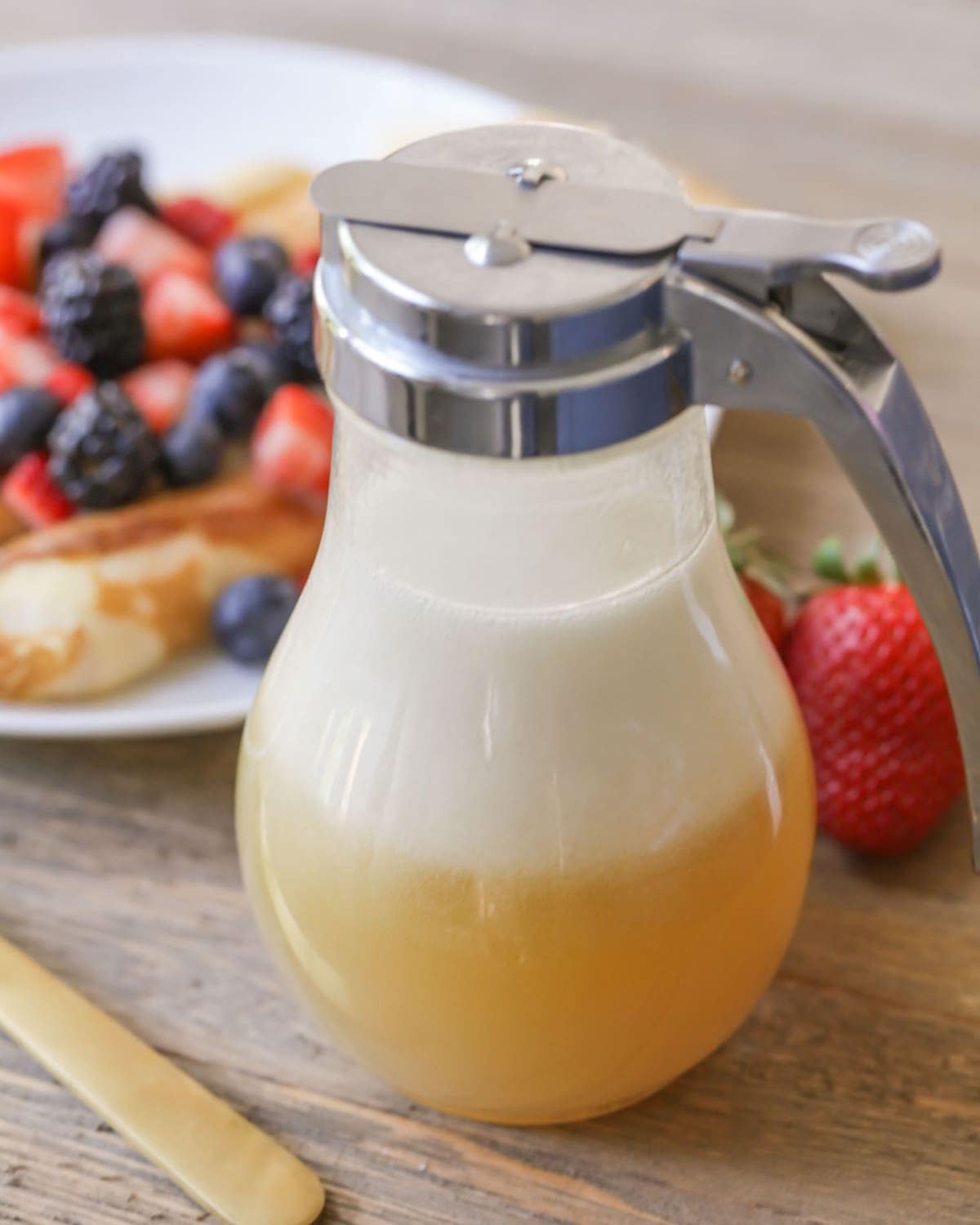 Homemade buttermilk syrup in a dispenser