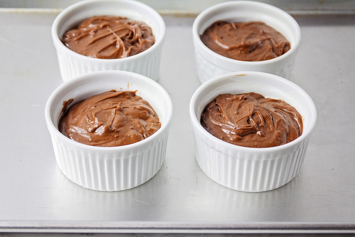 Lava cake batter in ramekins ready for baking.