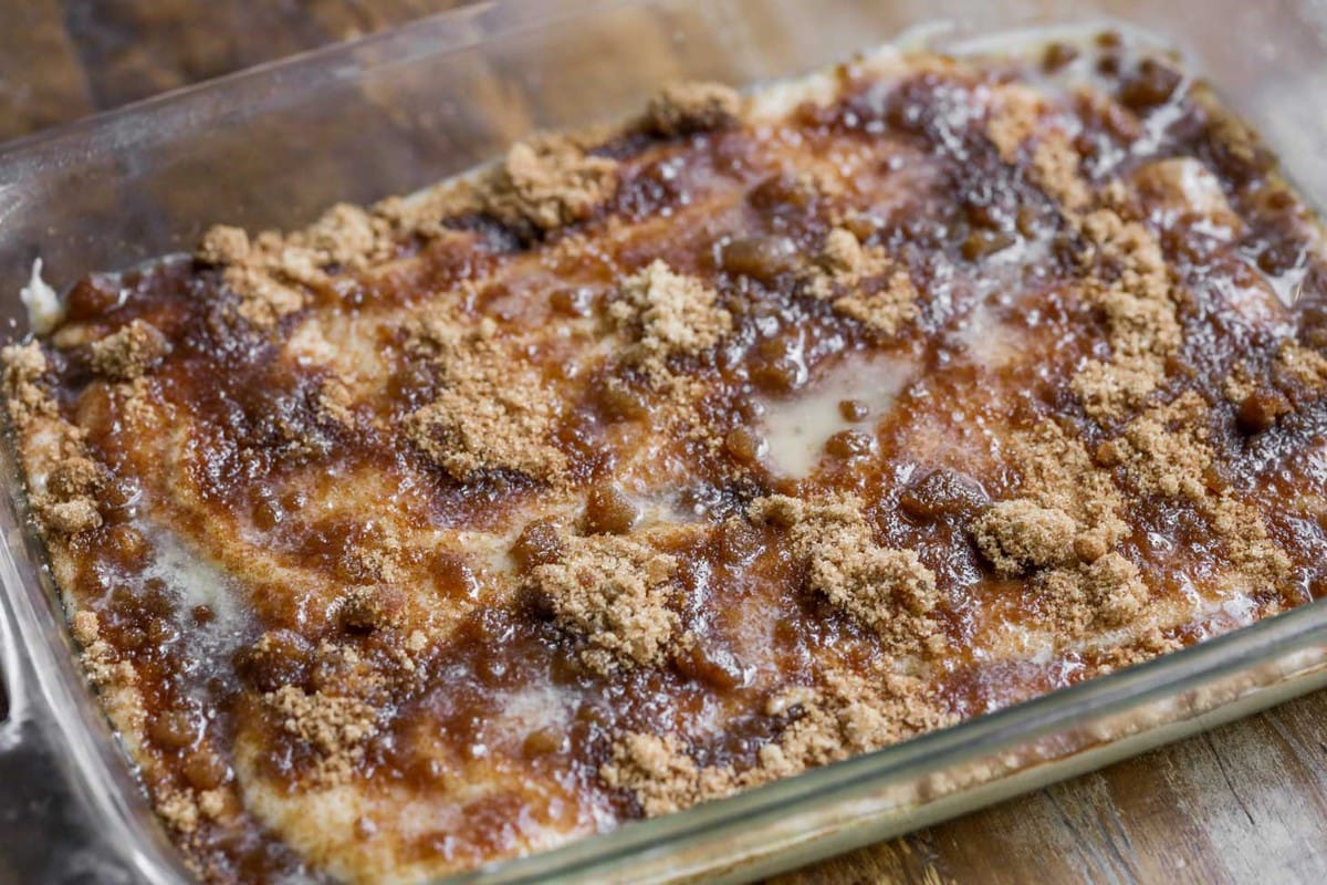 A glass baking dish filled with easy coffee cake read for baking.