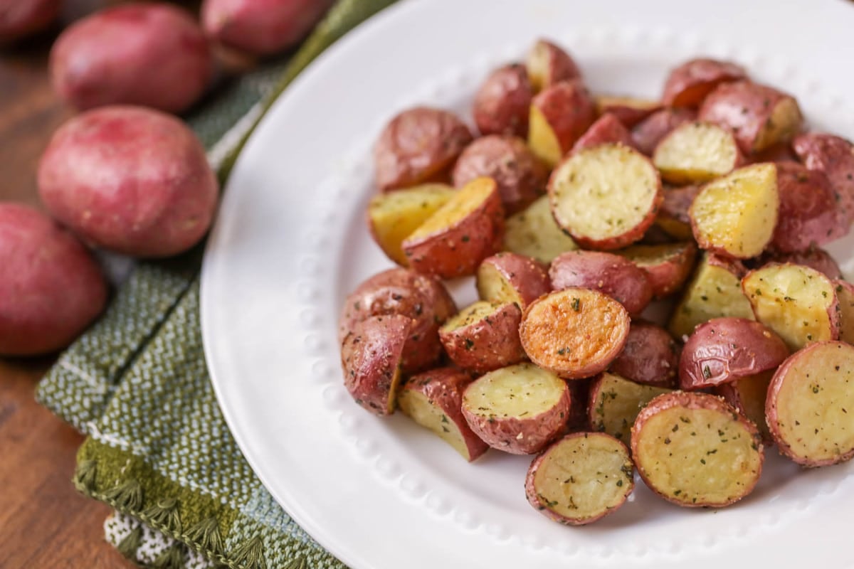 Serve baked pesto chicken with oven roasted red potatoes.