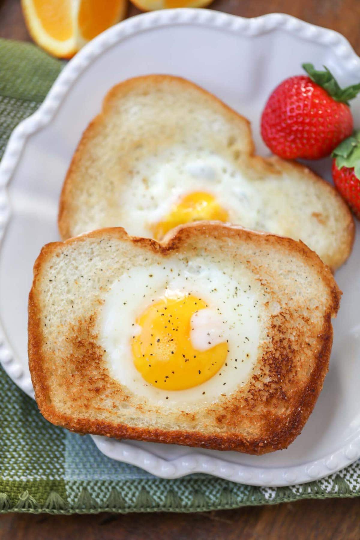 2 Easy Toad in the Hole stacked on a white plate.