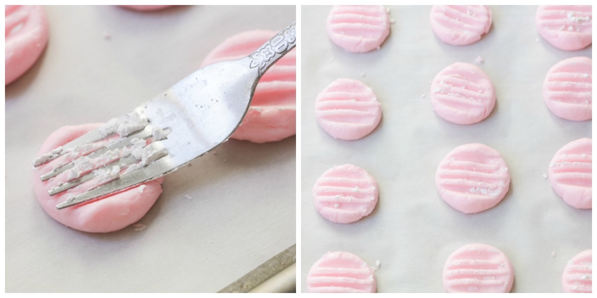 Pressing cream cheese mints with a fork to shape.
