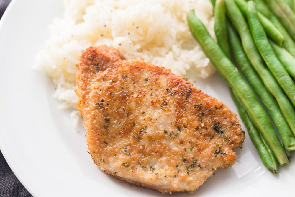 Parmesan crusted pork chops with rice and green beans