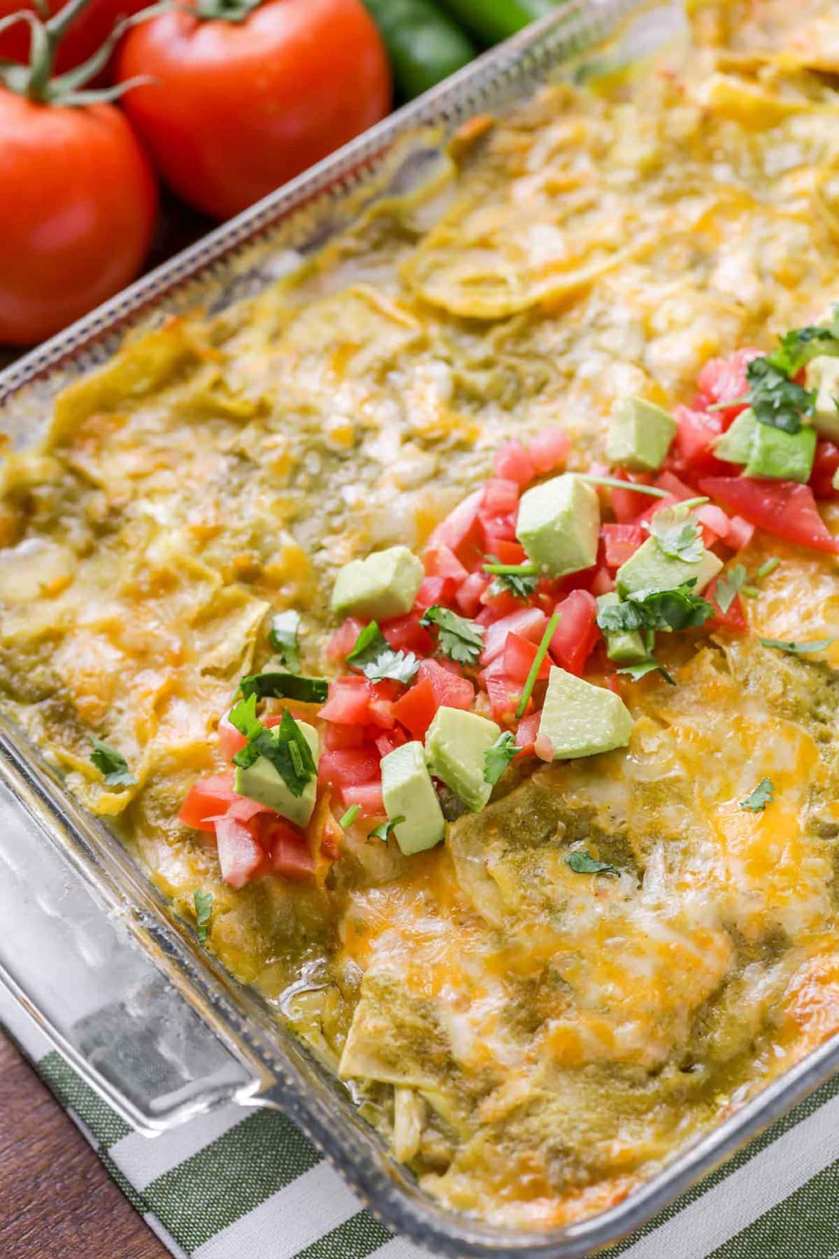 Chicken enchilada casserole with fresh toppings.