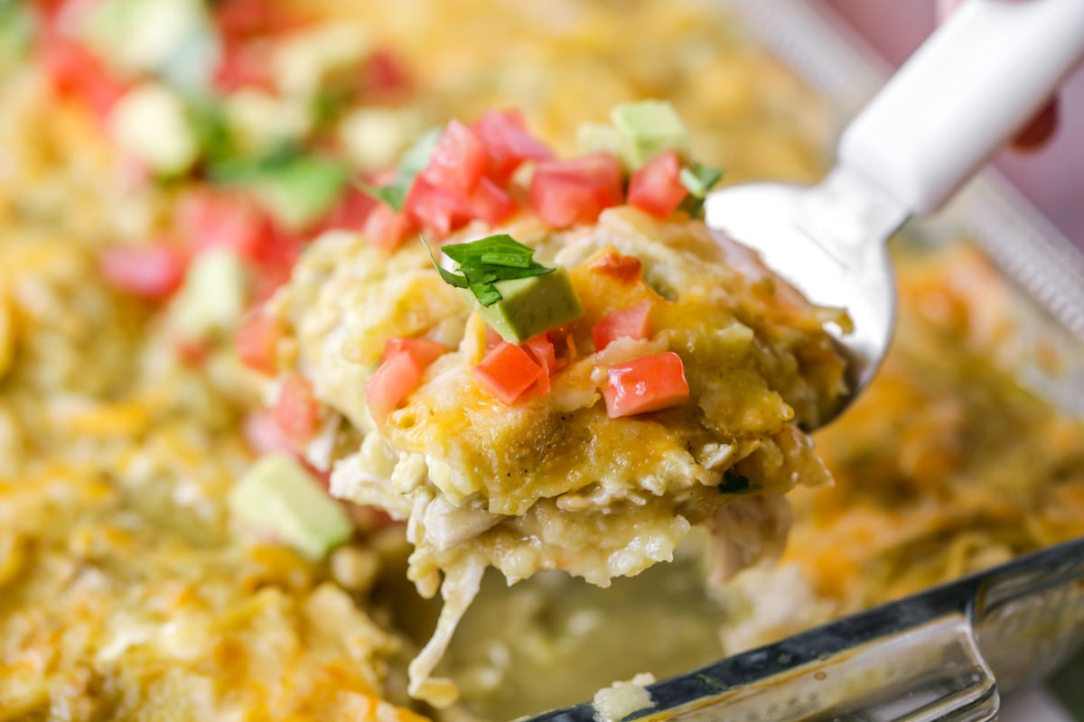 Chicken enchilada casserole in baking dish.