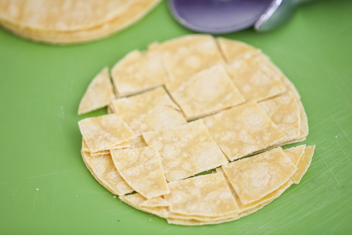 Corn tortilla slices for easy chicken enchilada casserole.