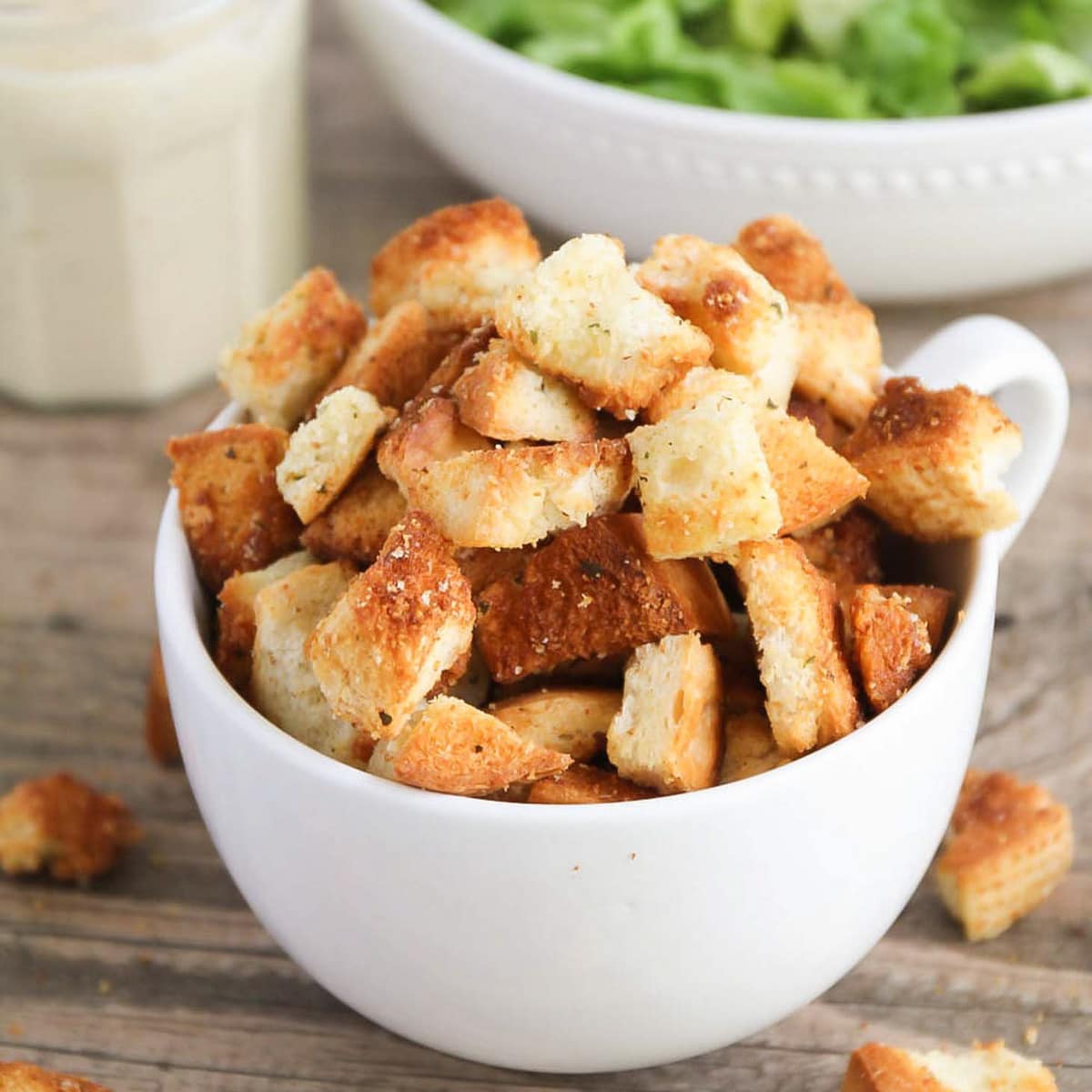 Homemade croutons served in a white bowl.