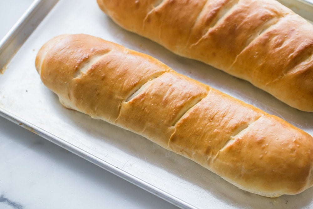 cooked french bread on a sheet pan