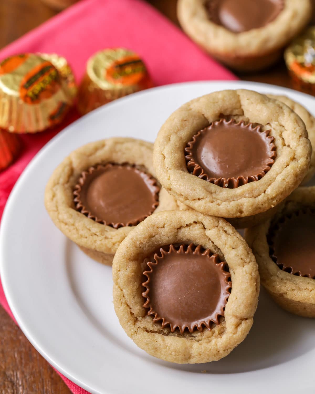 Peanut Butter Cup Cookies stacked on a white plate.