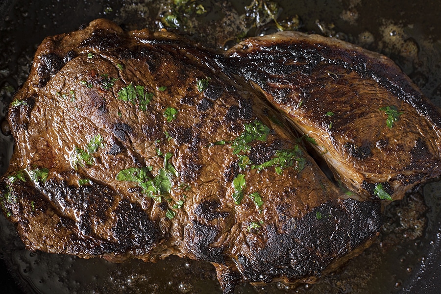 steak in a frying pan