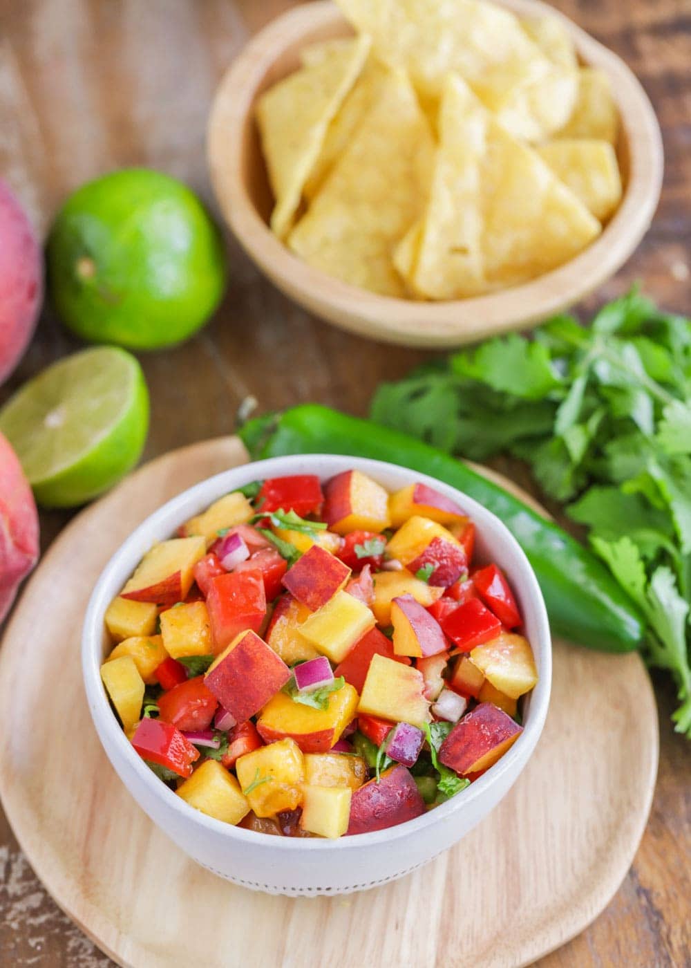 Fresh peach salsa served in a white bowl.