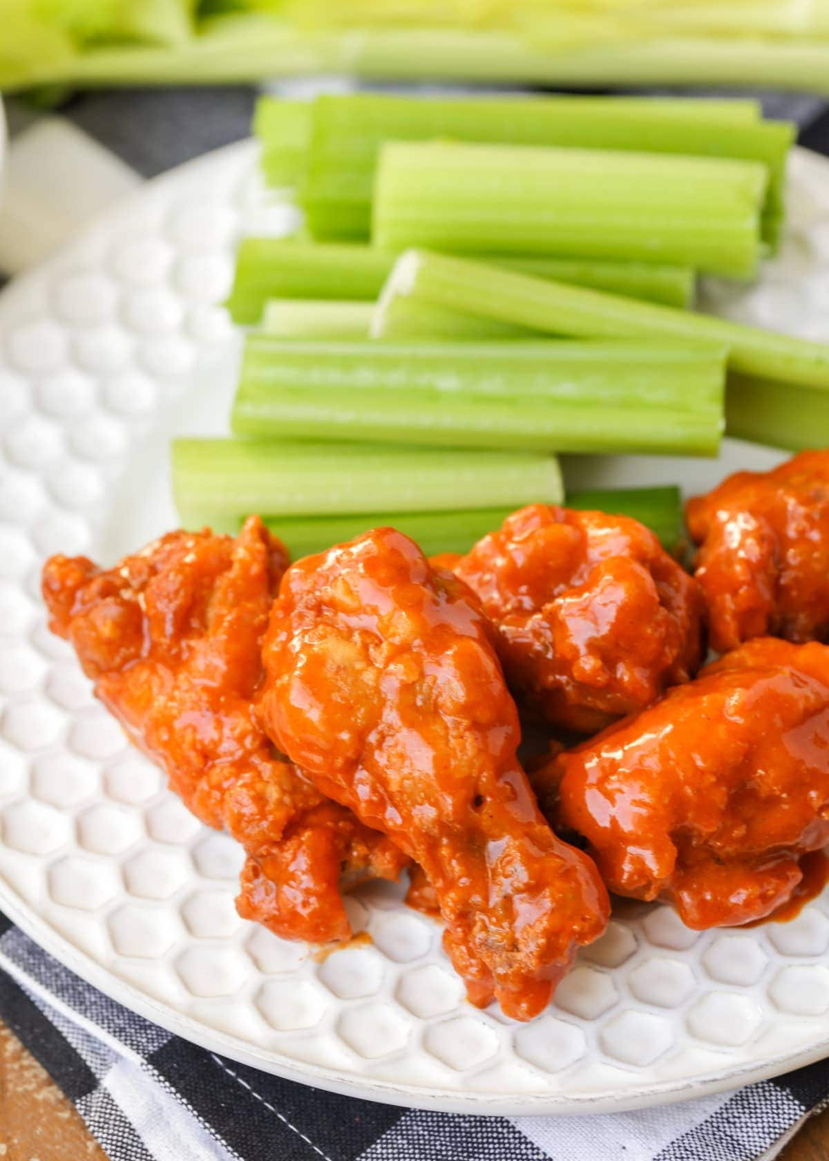 Buffalo chicken wings smothered in buffalo sauce and served with celery.