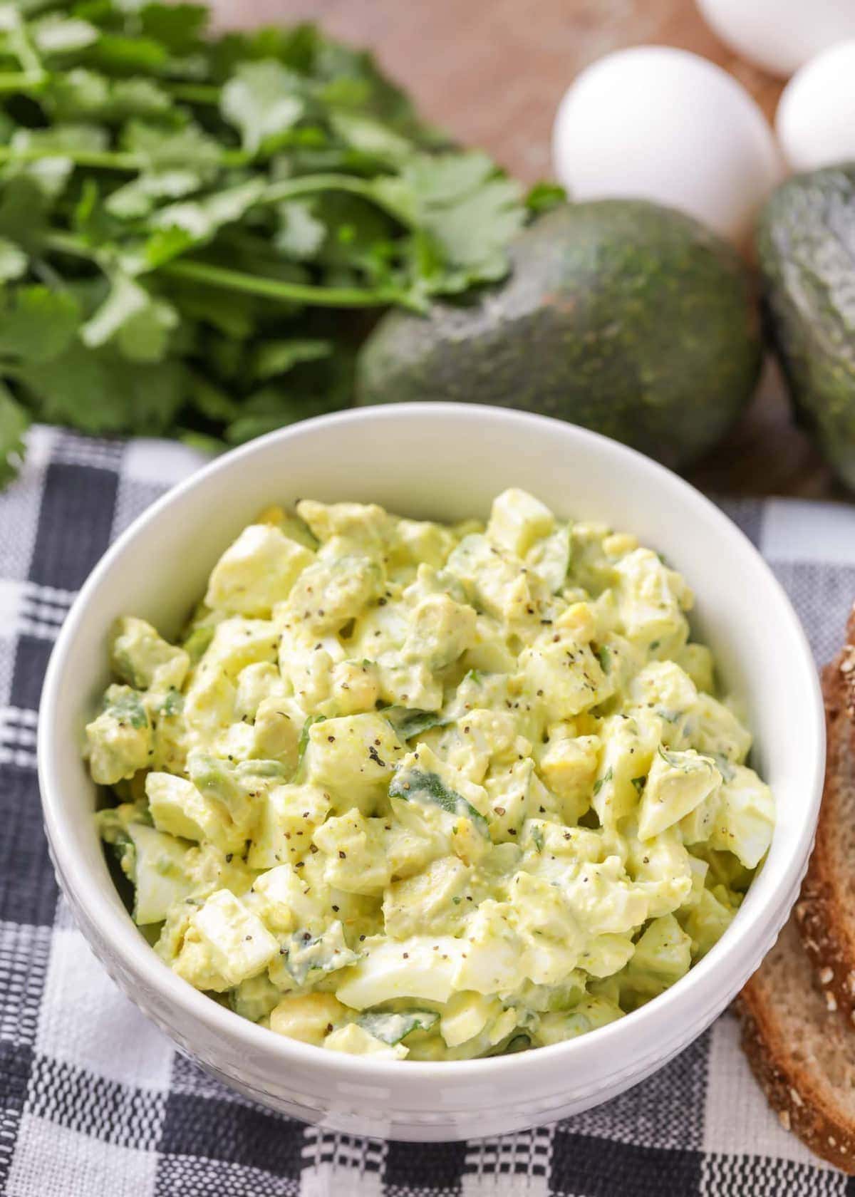 Avocado egg salad in a white bowl. 