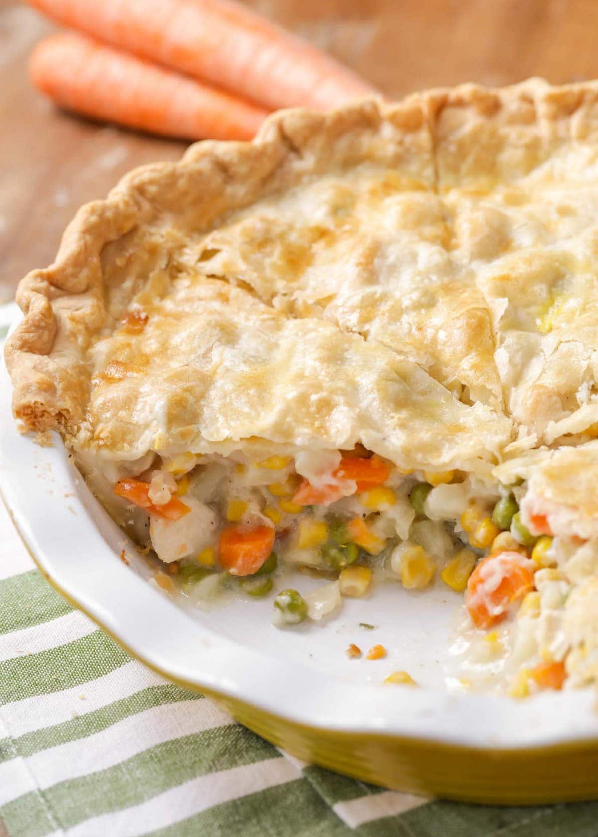 Close up of homemade chicken pot pie recipe with slice missing.