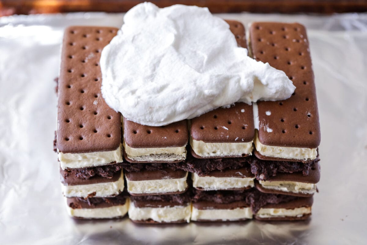 Process picture of ice cream sandwich cake - ice cream sandwiches stacked on each other.