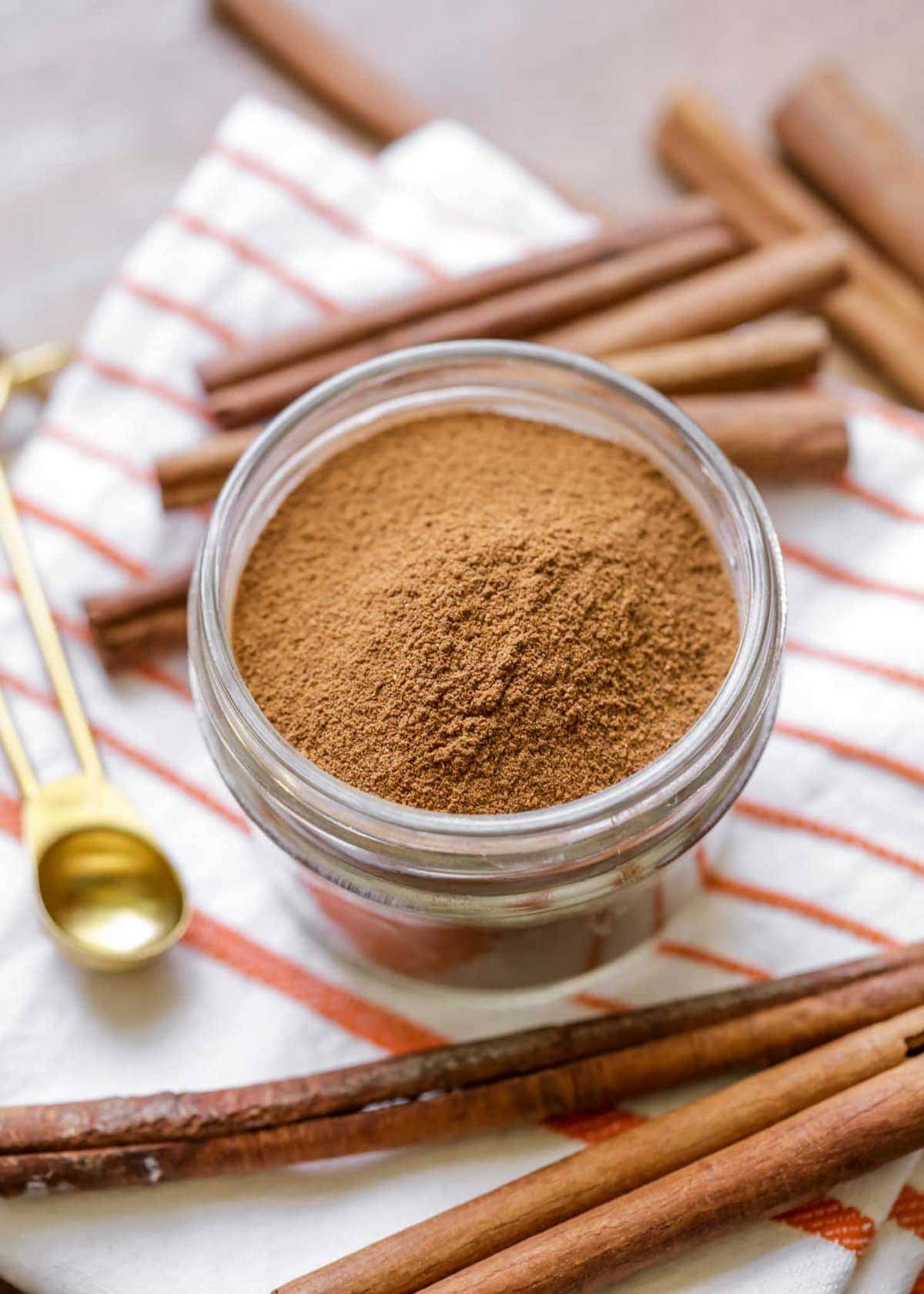 Homemade pumpkin pie spice in a glass jar.