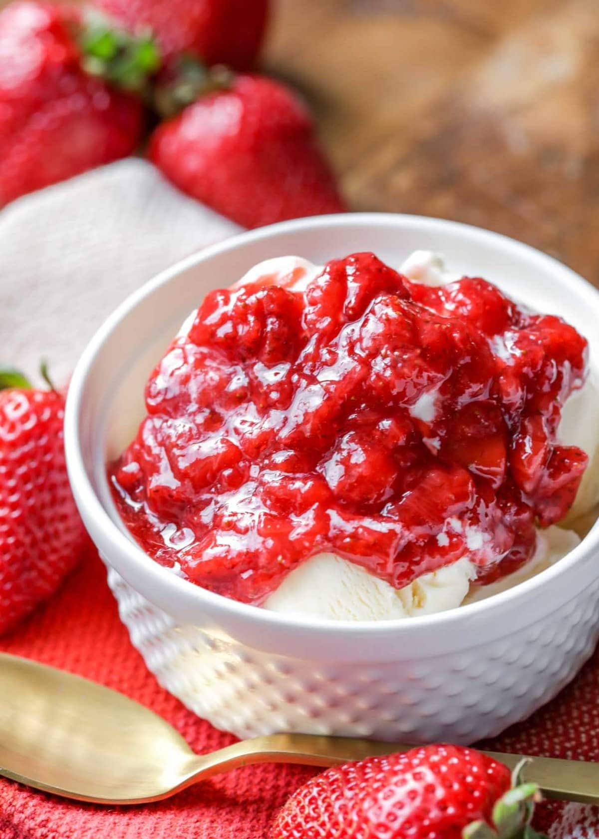 Simple strawberry sauce over vanilla ice cream