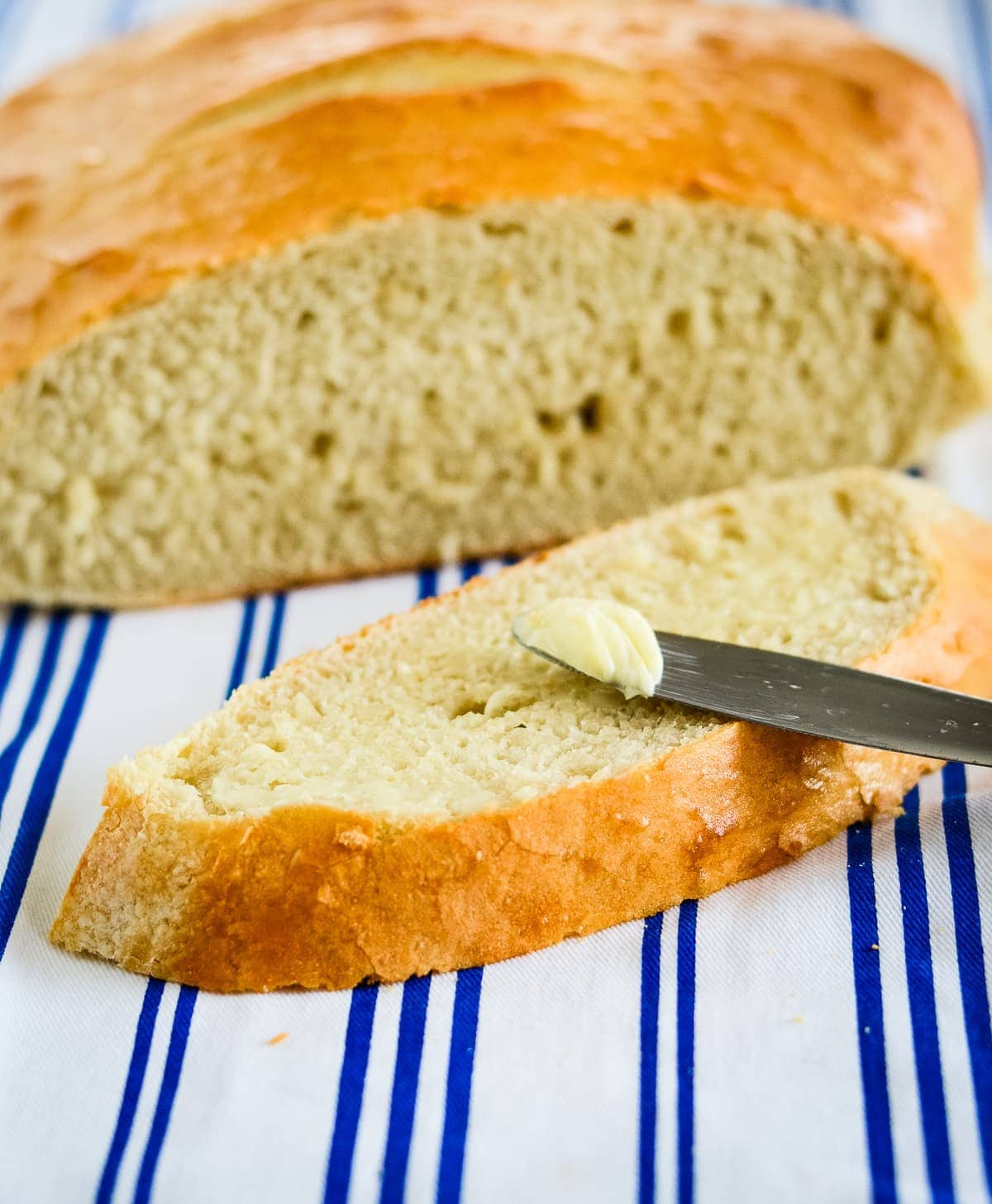 slice of homemade sourdough bread with butter