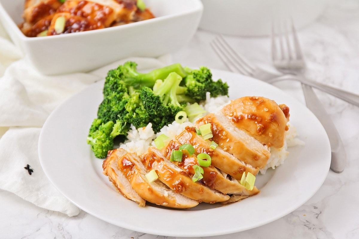 Baked teriyaki chicken served over white rice with broccoli.