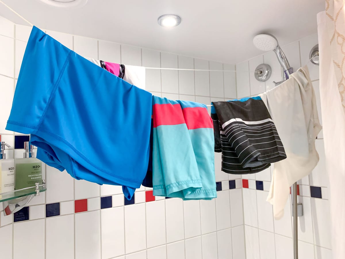 Wet clothes hanging in shower