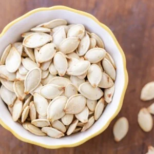 Bowl of roasted pumpkin seeds.