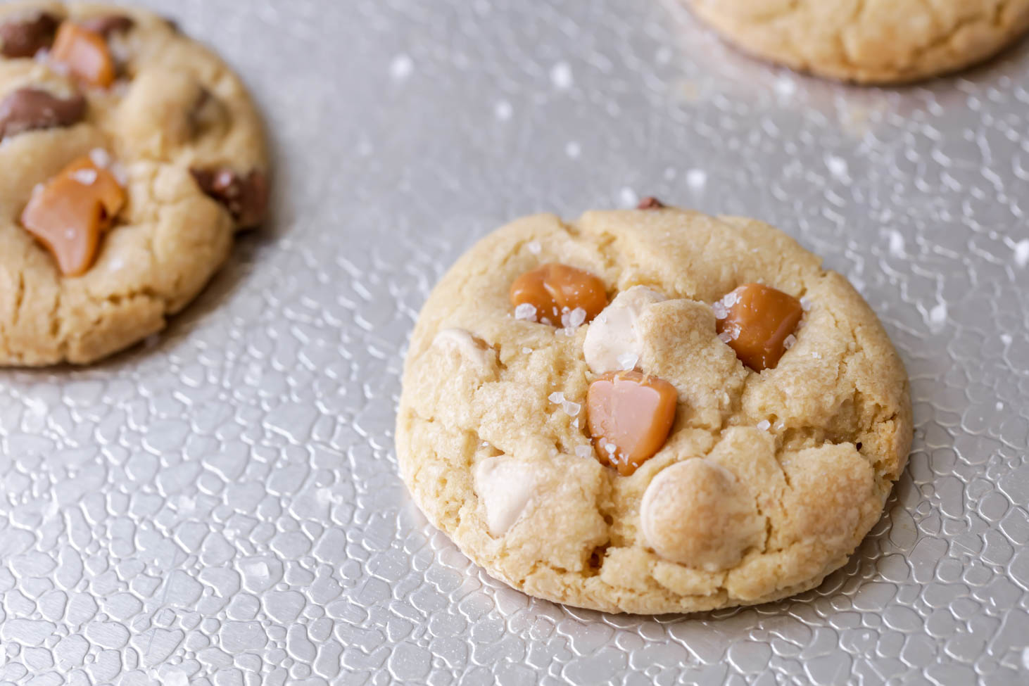 close up of caramel cookies on baking sheet