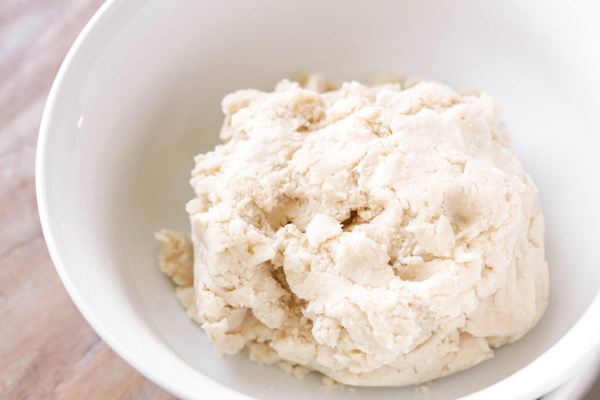 Biscuit dough mixed in a white bowl.