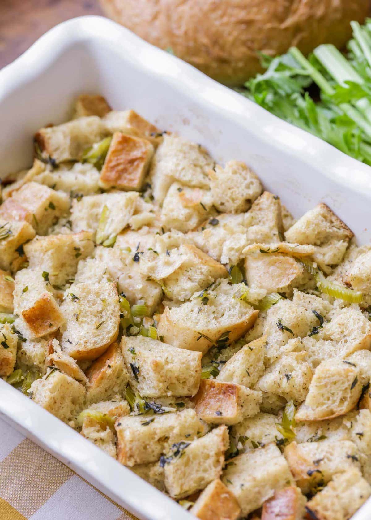 Thanksgiving stuffing recipe in a white serving dish.