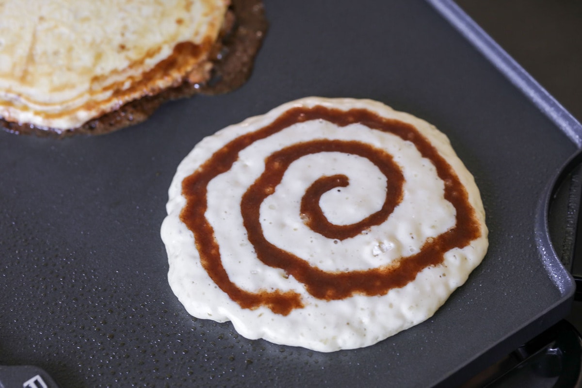pancake with cinnamon swirl on a griddle