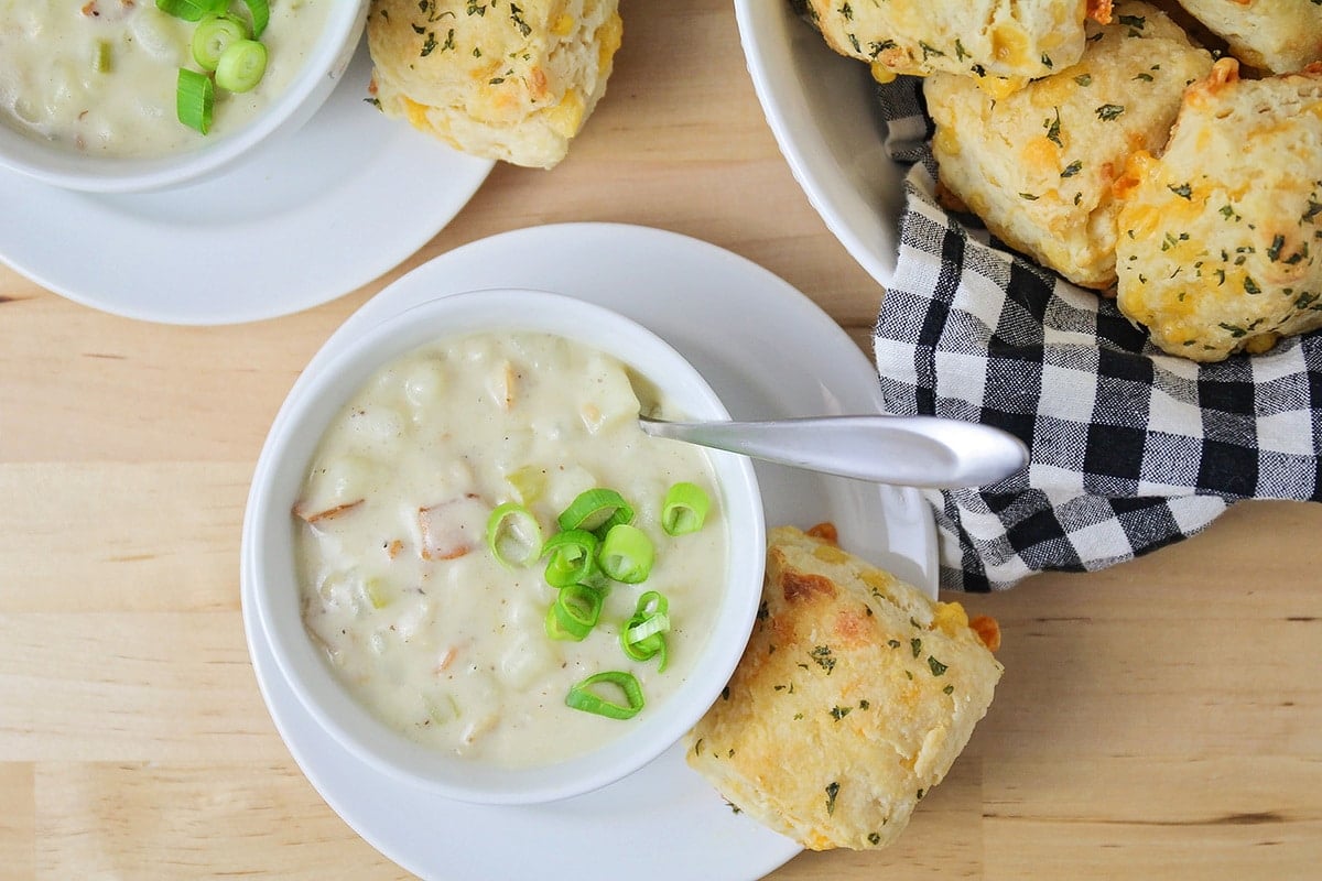 Overhead shot of chowder in a white bowl.