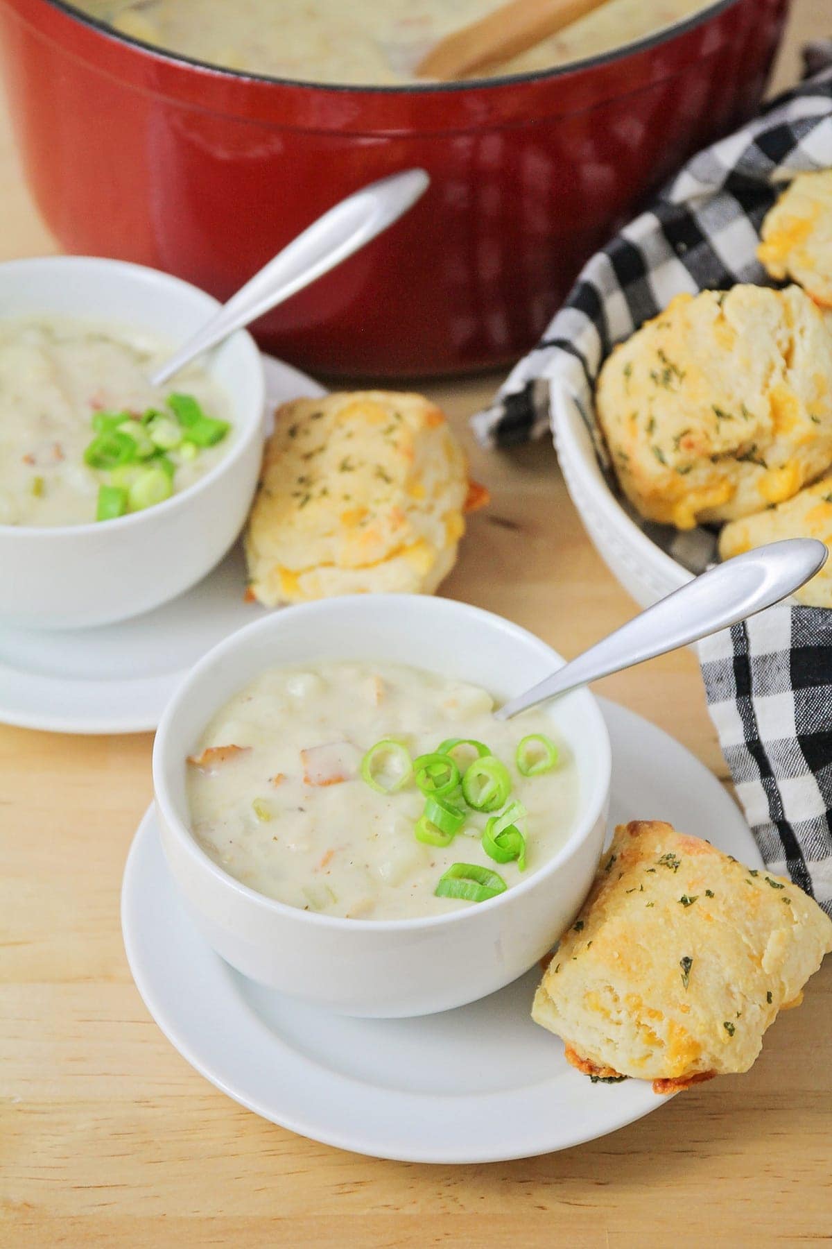 Homemade recipe for clam chowder topped with green onions.