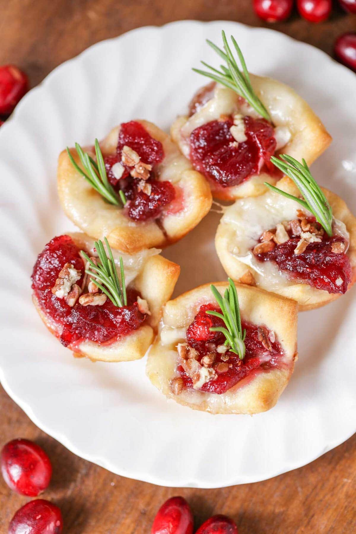 cranberry brie bites on a white plate